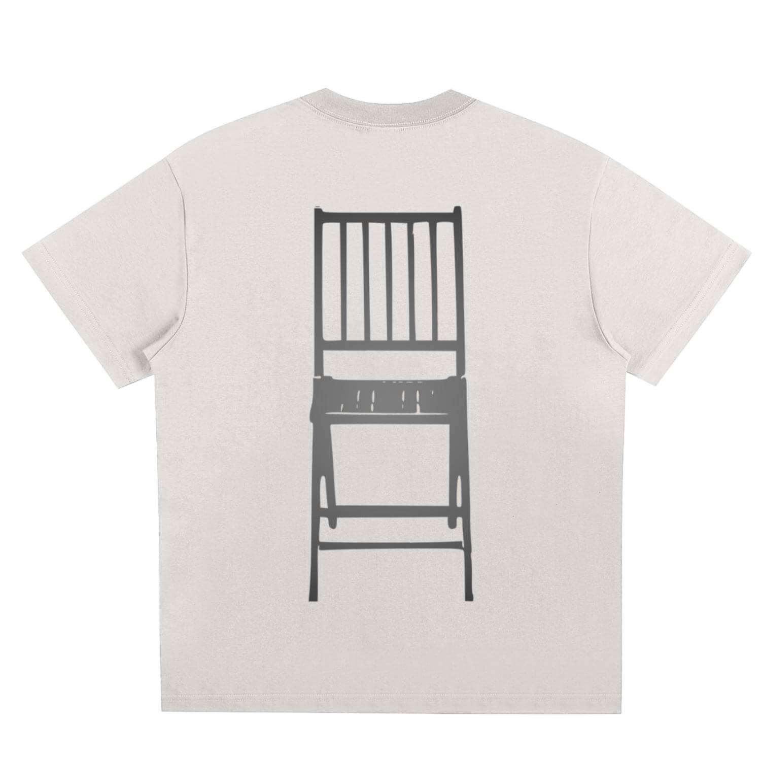 One in three chairs beige tshirt view from the back with large dark gray print of a wooden chair.